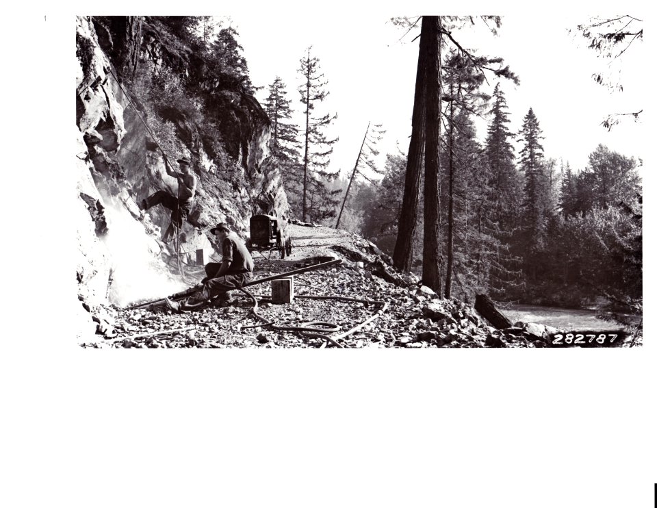 282787 CCC Boys Using Power Drill on Sauk Truck Trail, Mt. Baker NF, WA 9-16-1933
