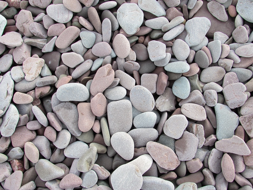 Pebbles stony background gray stone