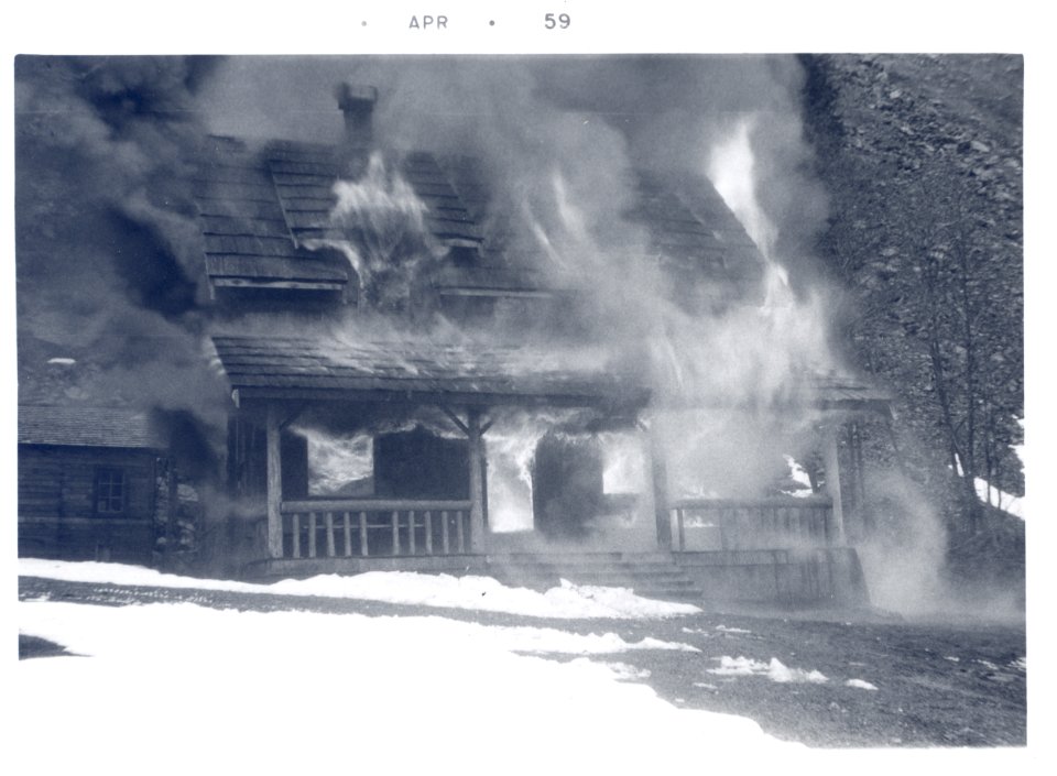 PO-40-3204- Old Denny Creek Ranger Station being burned- April 1959