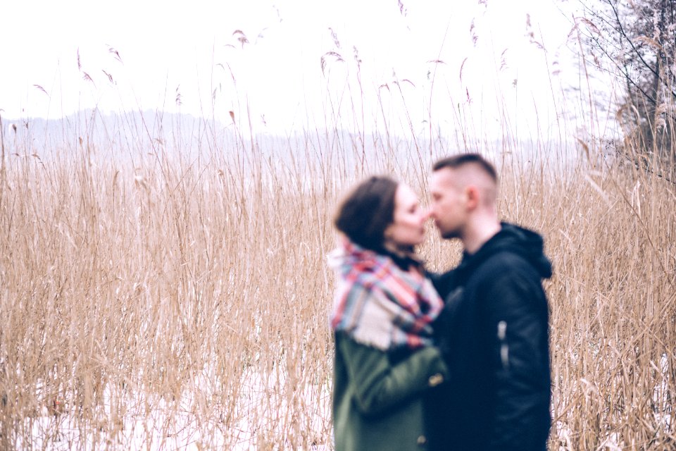A blurred couple about to kiss