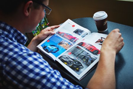 Man reading a magazine photo