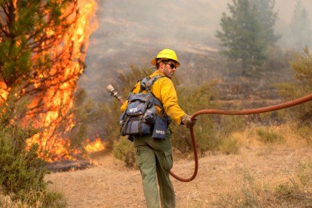 Firefighters conducting burnout operation