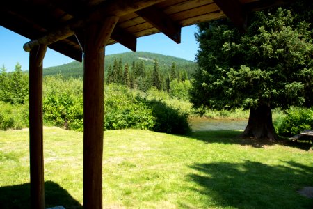 Take a break on the shady back porch of the Upper Ford Guard Station along the Yaak River