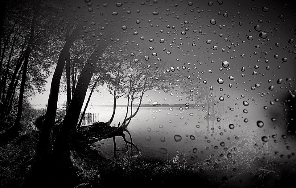The lake behind the wet glass
