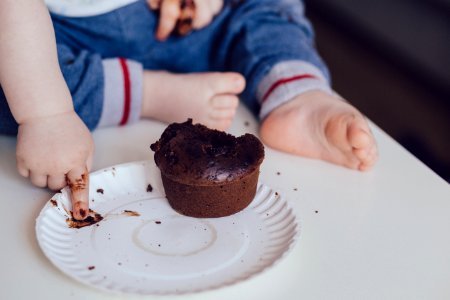 Baby eating a muffin photo