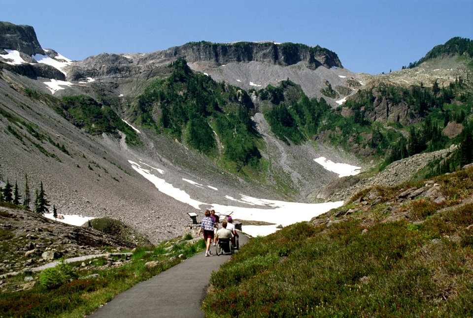 Disabled FS officials leads disabled visitor to a viewpoint, Mt Baker Snoqualmie National Forest