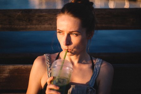 Girl drinking smoothie photo
