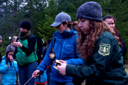 Rangers help with s'mores at a holiday tree outing at Gifford Pinchot National Forest, November 2018.  Photo by Sandy Burks.