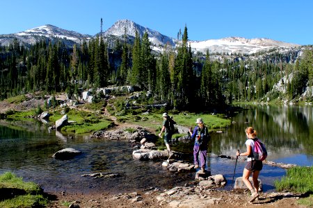 Hikers crossing Lake Creek on the way to Glacier Pass, Eagle Cap Wilderness on the Wallowa-Whitman National Forest photo