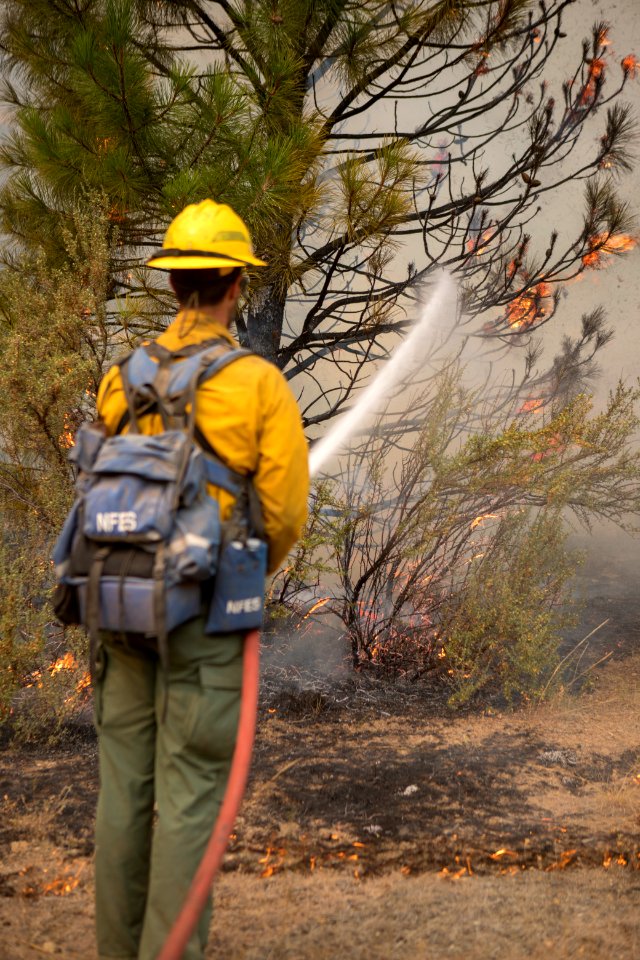 Firefighters conducting burnout operation