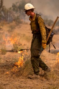 Firefighters conducting burnout operation