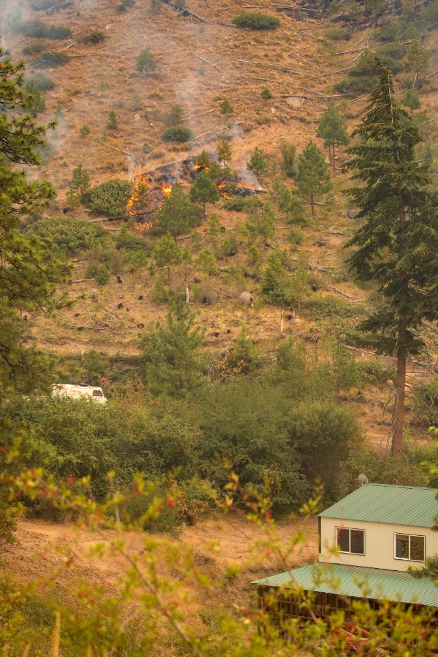 Careful tactical firing achieving low intensity burn around a home