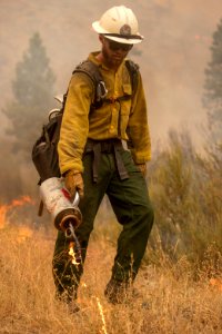 Firefighters conducting burnout operation