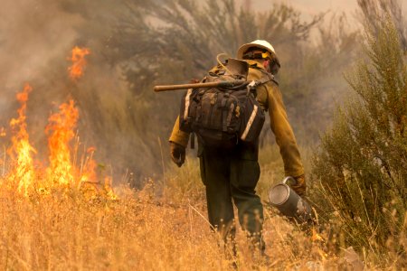 Firefighters conducting burnout operation