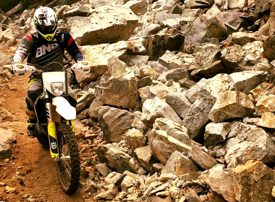 Motorcycle-RandyDietrichRidingNextToRockyHillside-OkaWenNFbyMasonSchuurUSFS-Aug24-2018