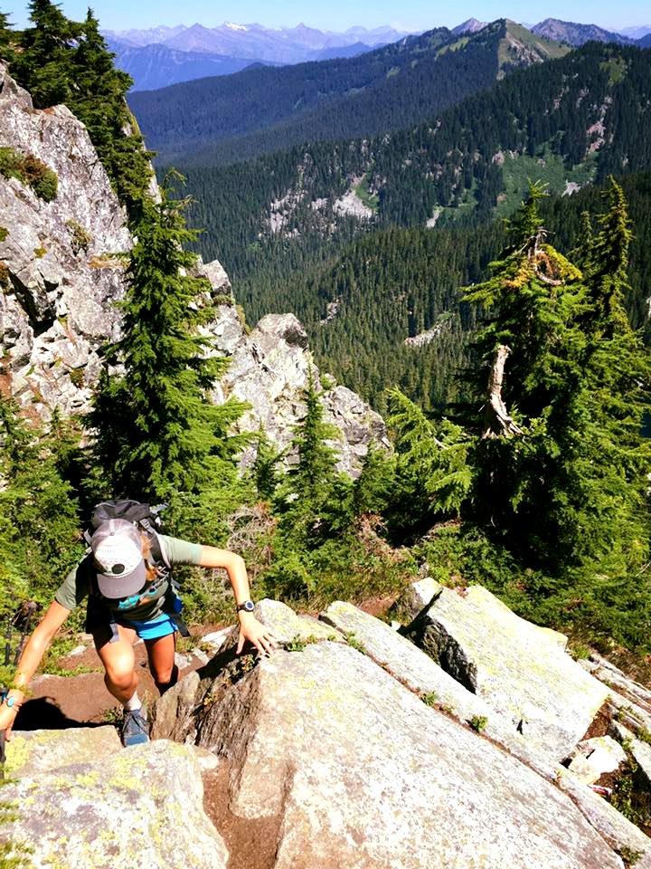 Hiker-KatyBinderScramblingUpRocks-OkaWenNFbyMasonSchuurUSFS-Aug7-2018