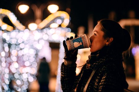Girl drinking coffee in winter photo