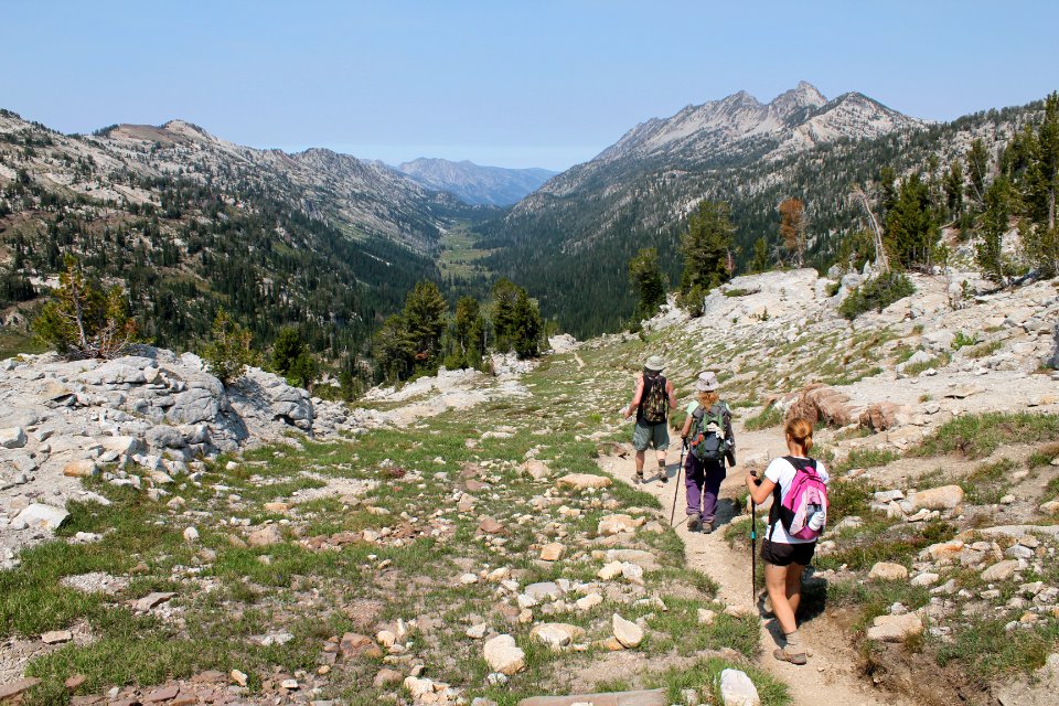 Hikers descending Eagle Cap Trail, with East Lostine valley in the background, Eagle Cap Wilderness on the Wallowa-Whitman National Forest