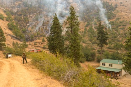 Careful tactical firing achieving low intensity burn around a home