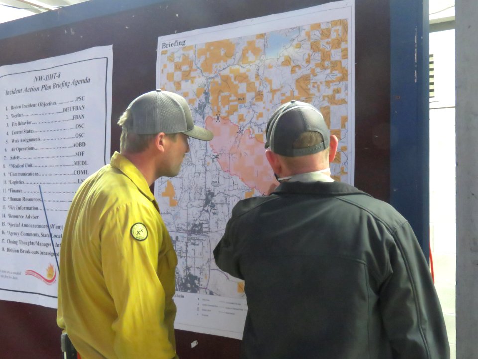 Getting assignments clear, two fiefighters have an intense discussion, South Obenchain Fire, 9-15-2020