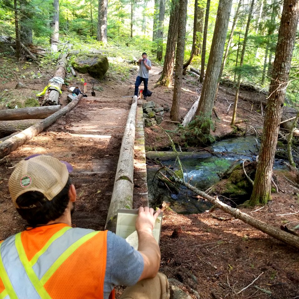 202010 Engineering staff make field measurements on the Buck Creek Trail Bridge on the western slope of Mt. Adams