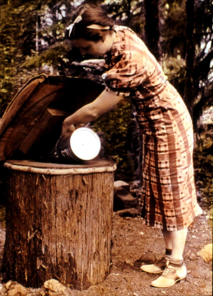 Mt. Hood NF - Woman at Eagle Creek CG Garbage Can, OR c1930