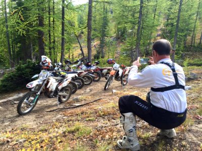 Motorcycle-MichaelForneyTakingPictureOfMotorcycles-OkaWenNFbyMasonSchuurUSFS-Sept18-2016