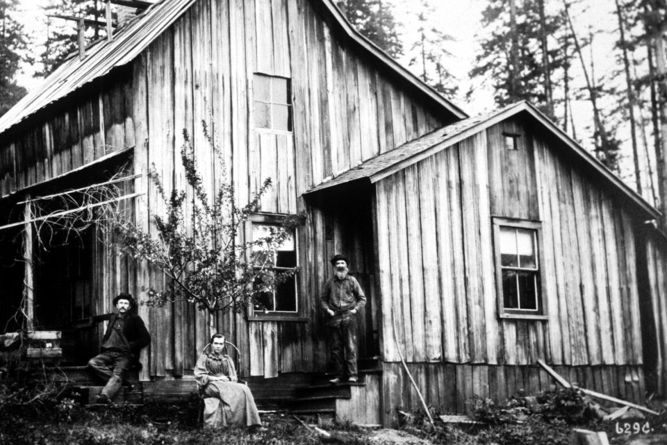 406 Homesteaders pose at their home in the woods