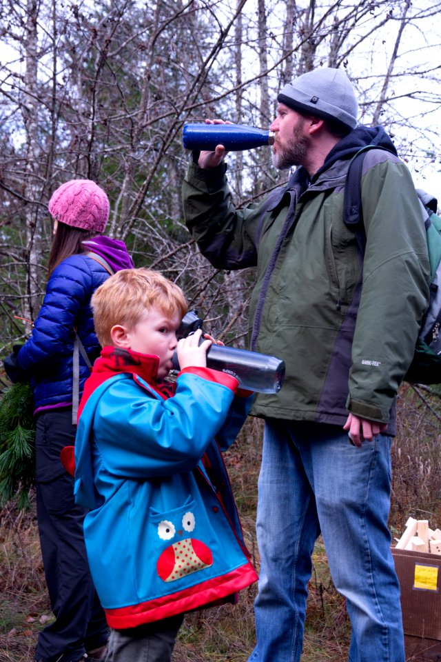 Staying hydrated is always a good idea! Drinking water at a holiday tree outing at Gifford Pinchot National Forest, November 2018.