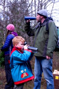 Staying hydrated is always a good idea! Drinking water at a holiday tree outing at Gifford Pinchot National Forest, November 2018.