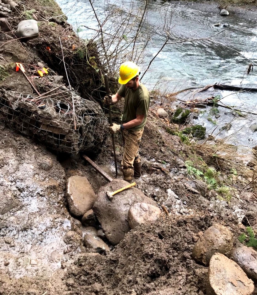 20210121-CRGNSA-Eagle Creek Trail being repaired by a trail crew member after a heavy rainstorm.