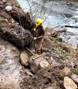 20210121-CRGNSA-Eagle Creek Trail being repaired by a trail crew member after a heavy rainstorm.