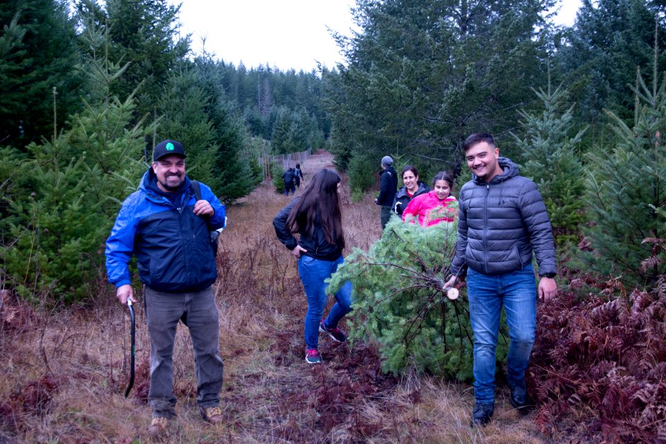 All smiles at a holiday tree outing at Gifford Pinchot National Forest, November 2018.  Photo by Sandy Burks.