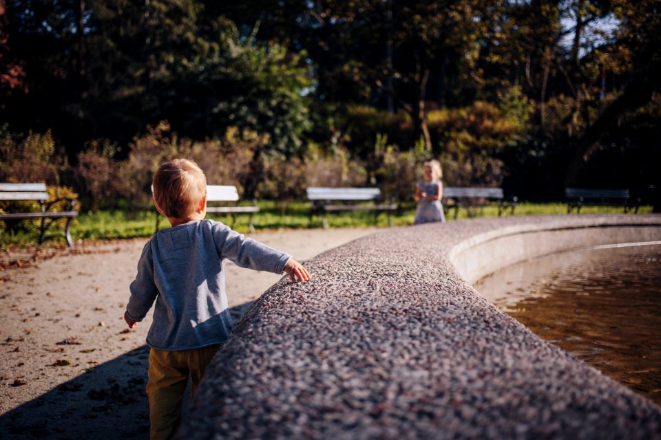 Brother and sister at a fountain