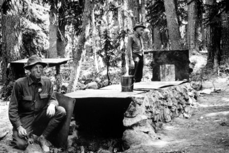 053 CCC boys pose at a campground cooking area, 1930's