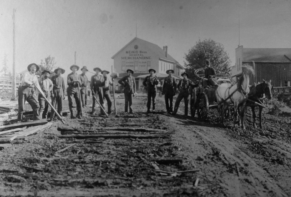449 Sandy, OR road crew building corduroy road in town