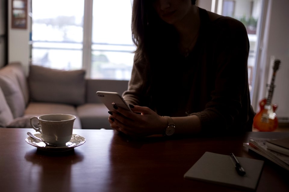 Female holding iPhone 8 plus