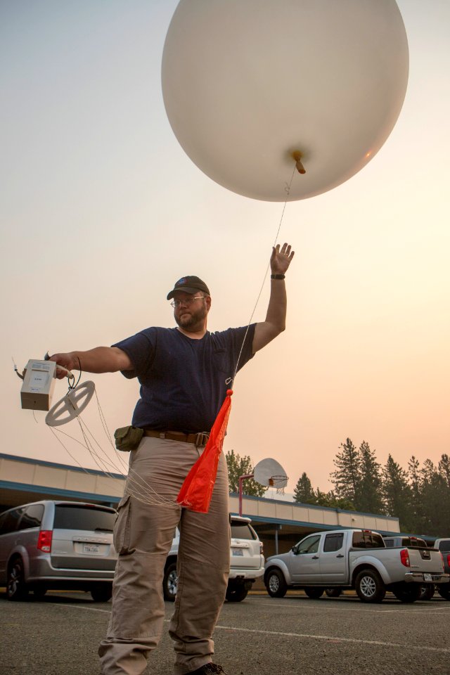 Incident Meteorologist (trainee) Royce Fontenot releasing a weather balloon