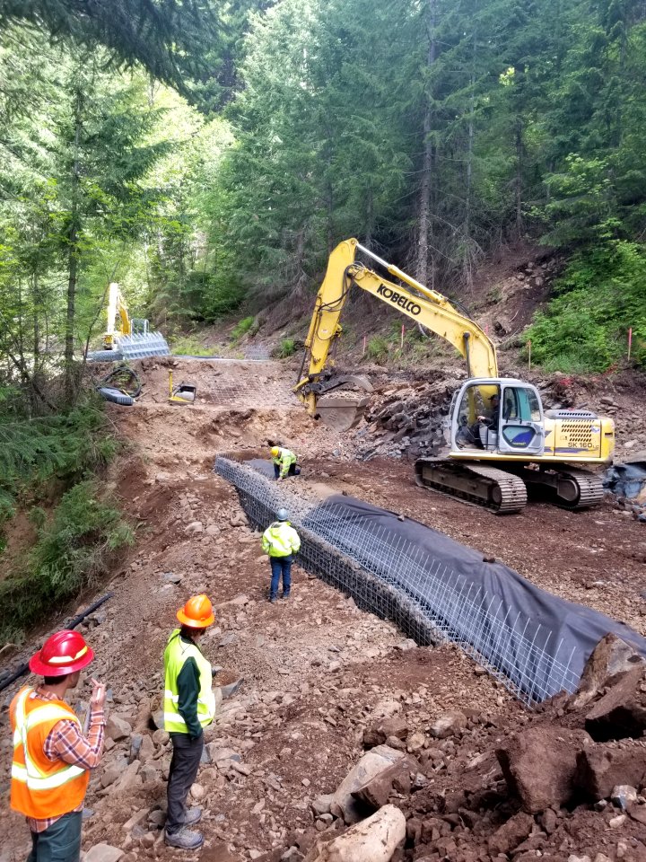 20200604 Gifford Pinchot Forest Service and contractor employees work together to completed a retaining wall on the Forest Road 68, roads system.