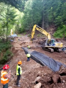 20200604 Gifford Pinchot Forest Service and contractor employees work together to completed a retaining wall on the Forest Road 68, roads system.