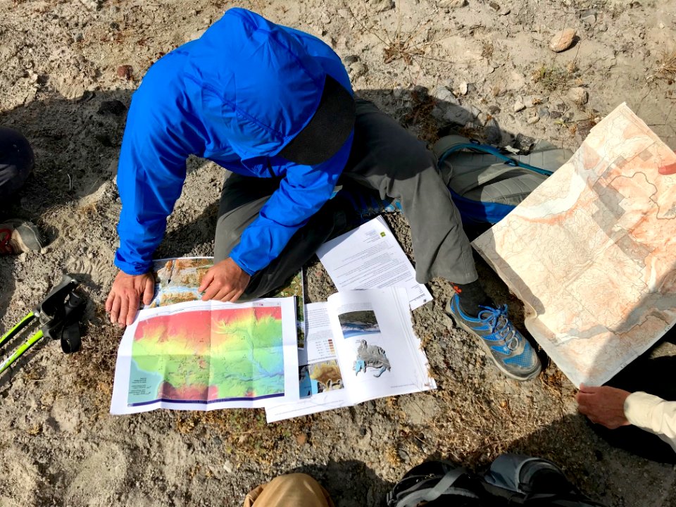 201806 USFS GiffordPinchot Hydrologist reviewing data on the pumice plain. Photo by Johna Hogervorst, Forest Service employee