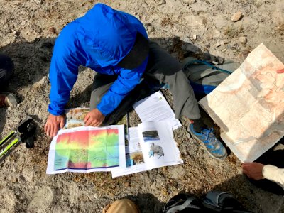 201806 USFS GiffordPinchot Hydrologist reviewing data on the pumice plain. Photo by Johna Hogervorst, Forest Service employee