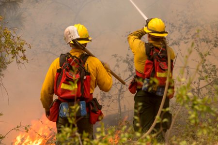 Firefighters conducting burnout operation