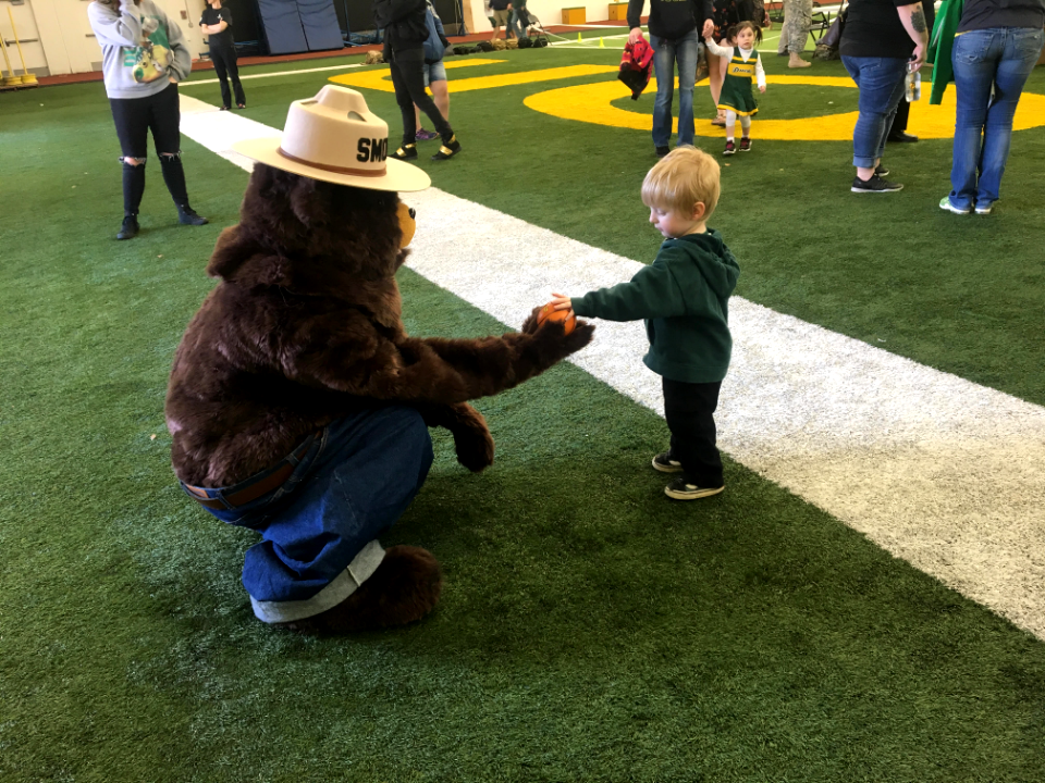 Making Christmas ornaments at the University of Oregon spring football game.