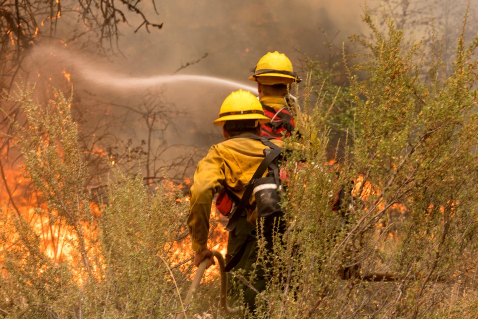 Firefighters conducting burnout operation