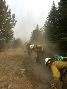 Firefighters digging fire line on the Uno Peak Fire, 2017