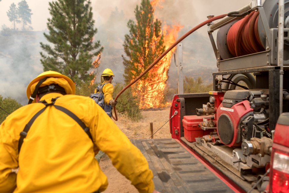 Firefighters conducting burnout operation