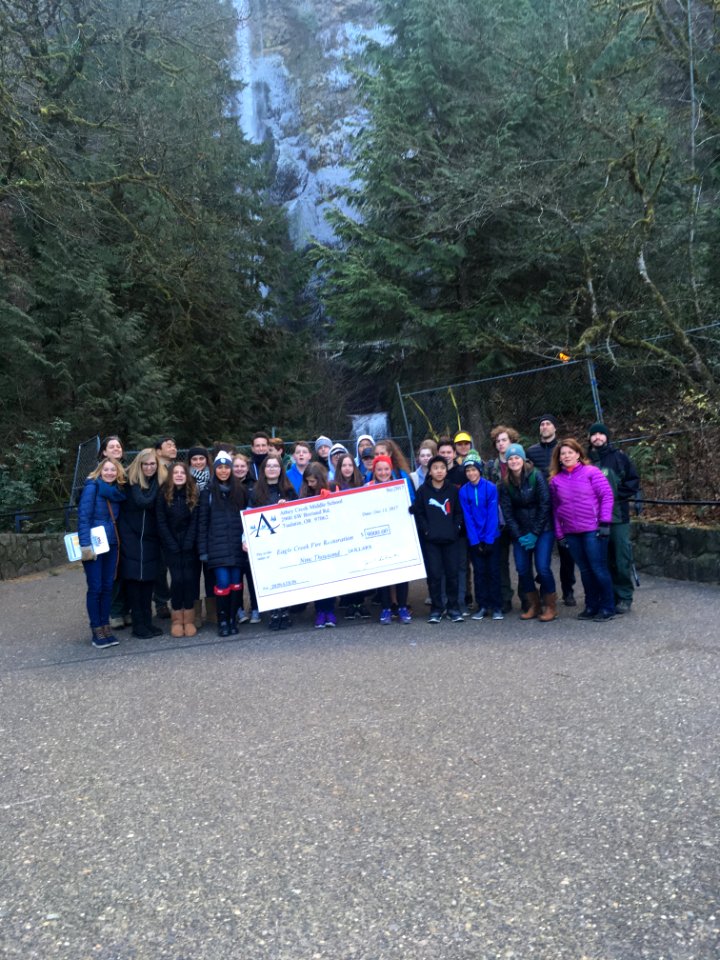 Athey Creek Middle School 8th Graders present a $9,000 check towards Eagle Creek Fire recovery efforts.