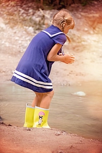 Girl rubber boots water photo