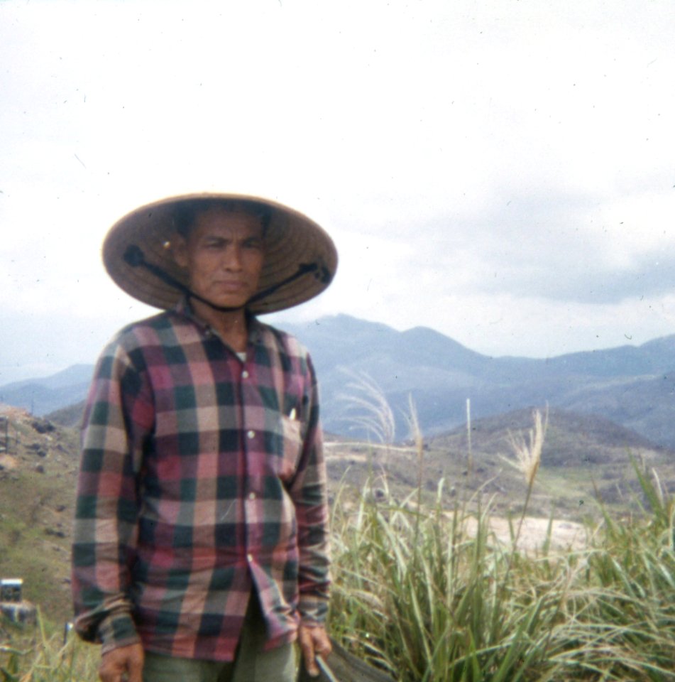 Vietnamese worker at Vung Chua Mountain signal station